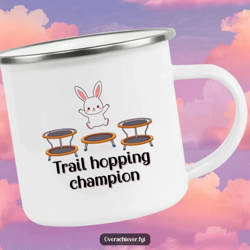 Funny camping mug featuring a tiny rabbit character hopping on three trampolines, ready for outdoor fun and invigorating brews.