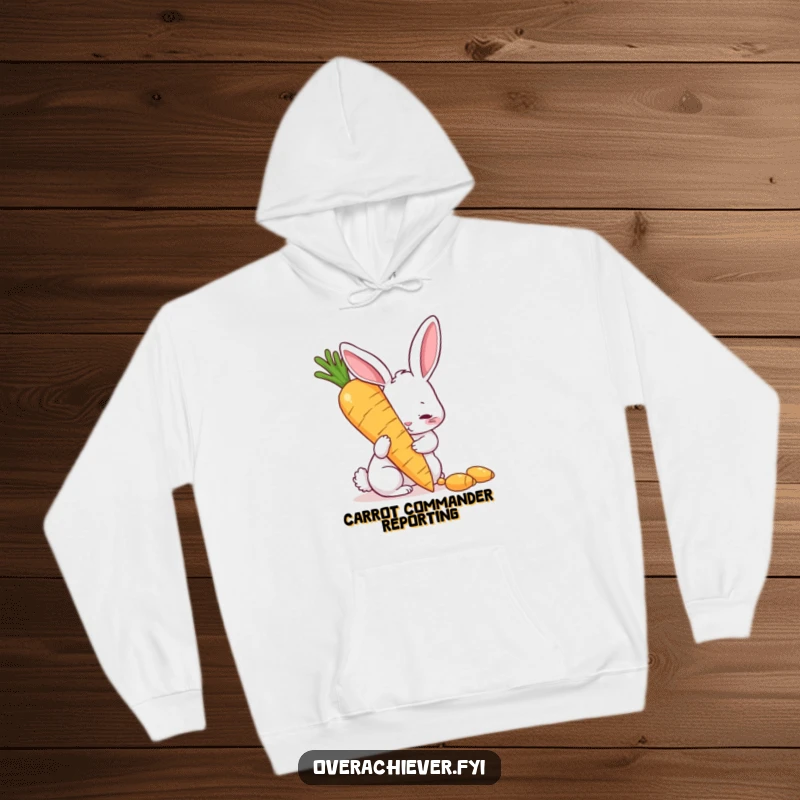 Funny hoodie depicting a determined rabbit polishing a colossal golden carrot, representing humorous perseverance and a great funny gift idea.