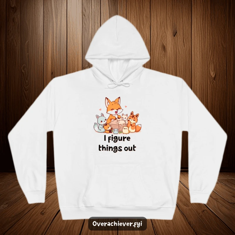 Funny hoodie print: An excited fox character helps tiny creatures assemble a large, intricate puzzle, showcasing collaboration and fun.