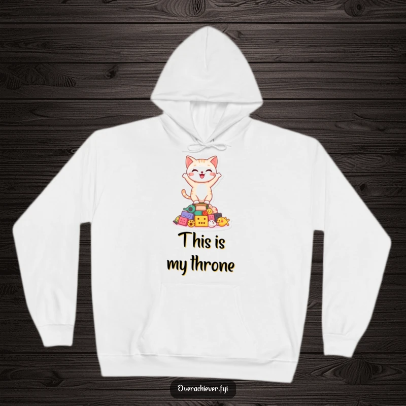 Cozy funny happy cat character balancing with pride on a shaky tower of toys on a warm hoodie, perfect for relaxed moments.