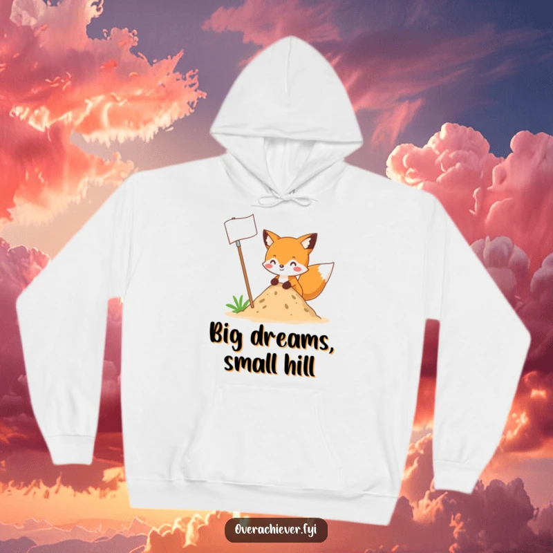 Funny fox character planting an enormous flag into a tiny mound of dirt, depicted on a cozy hoodie, a hilarious and funny gift.