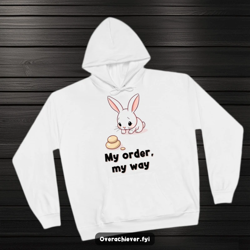Funny Bunny Hoodie: A focused bunny carefully arranging pebbles in a perfect line, offering humorous warmth and style.