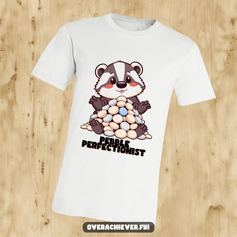 Funny t-shirt featuring a proud badger showcasing a meticulously organized pile of shiny pebbles, embodying humorous order and pride, a funny gift.