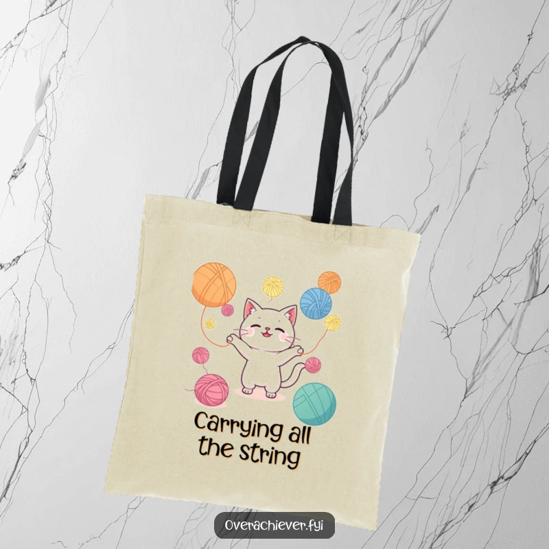 Funny Kawaii cat character juggling a mountain of yarn balls on this tote bag, perfect for carrying supplies and smiles.